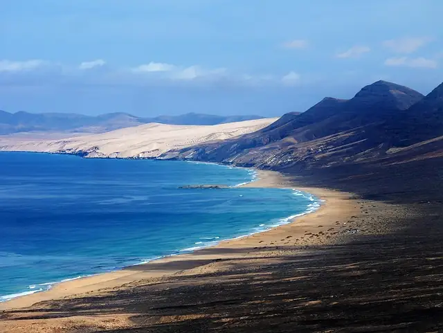 Long sandy beach and mountains on Fuerteventura, Canary Islands